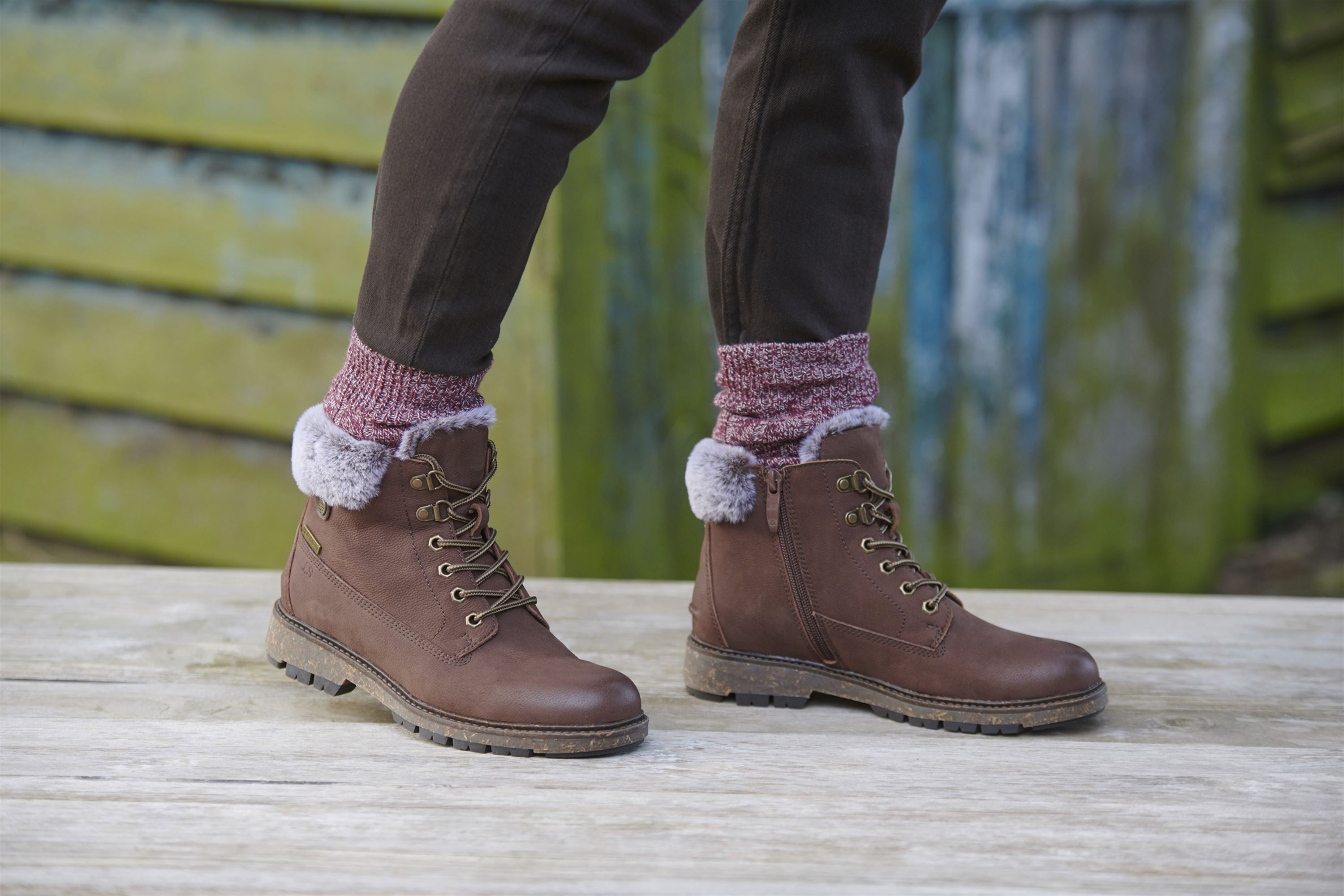 woman wearing metallic lace up shoes