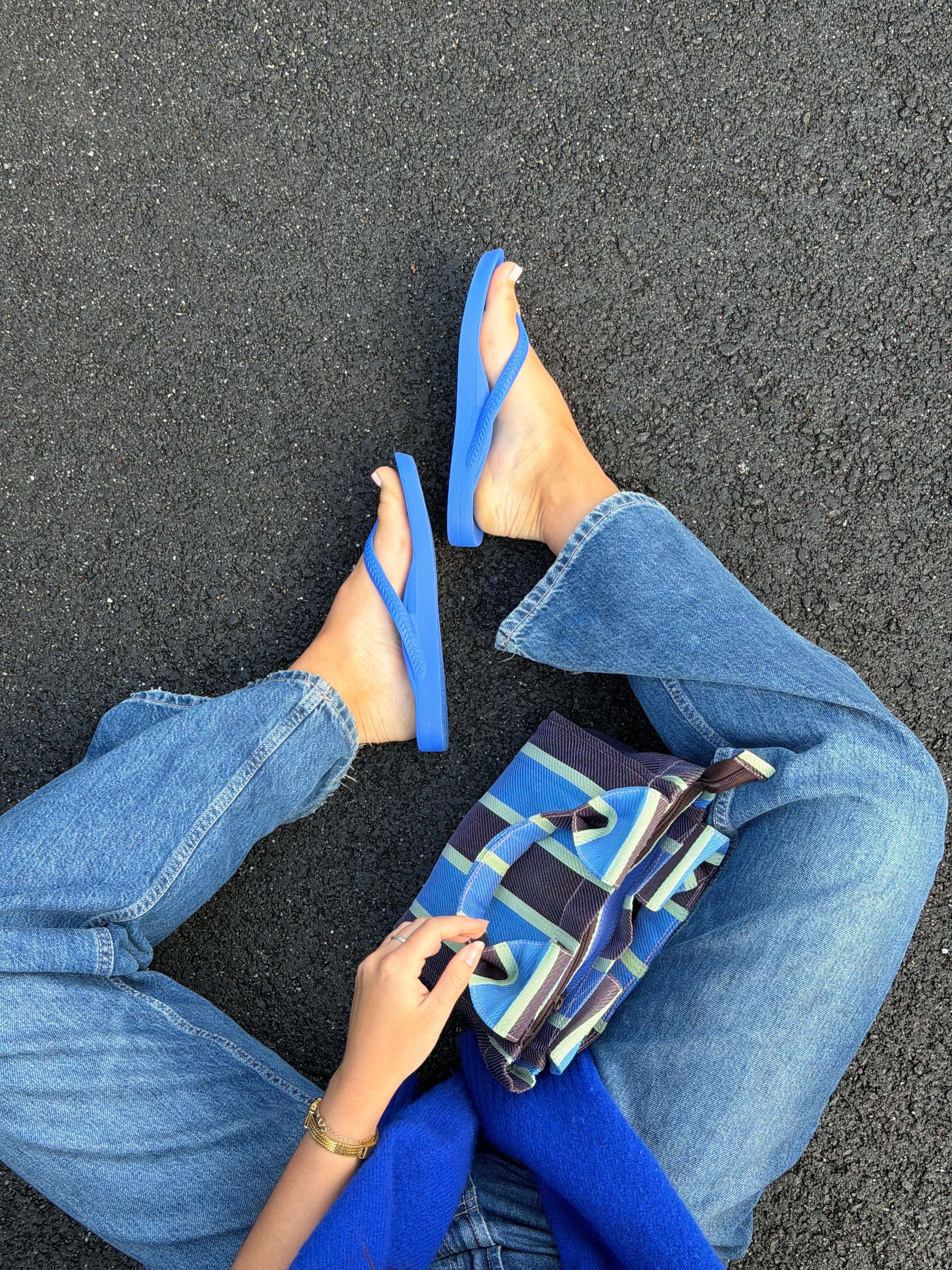 Woman wearing navy wedge sandals