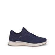 A navy blue suede and mesh athletic sneaker with a thick white midsole and a light brown outsole, shown from a side profile on a white background.