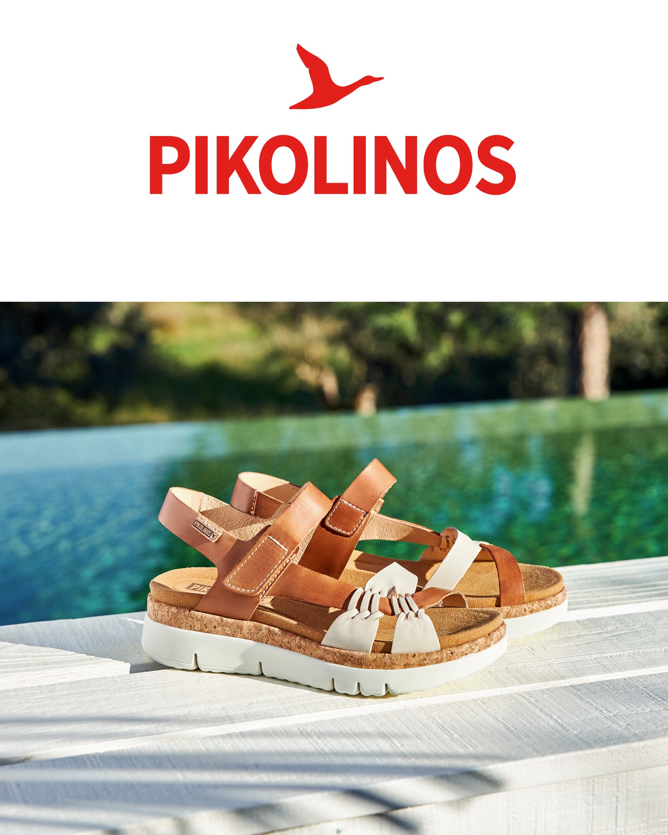 Brown sandals with white soles on a table by a pool, featuring the Pikolinos brand.