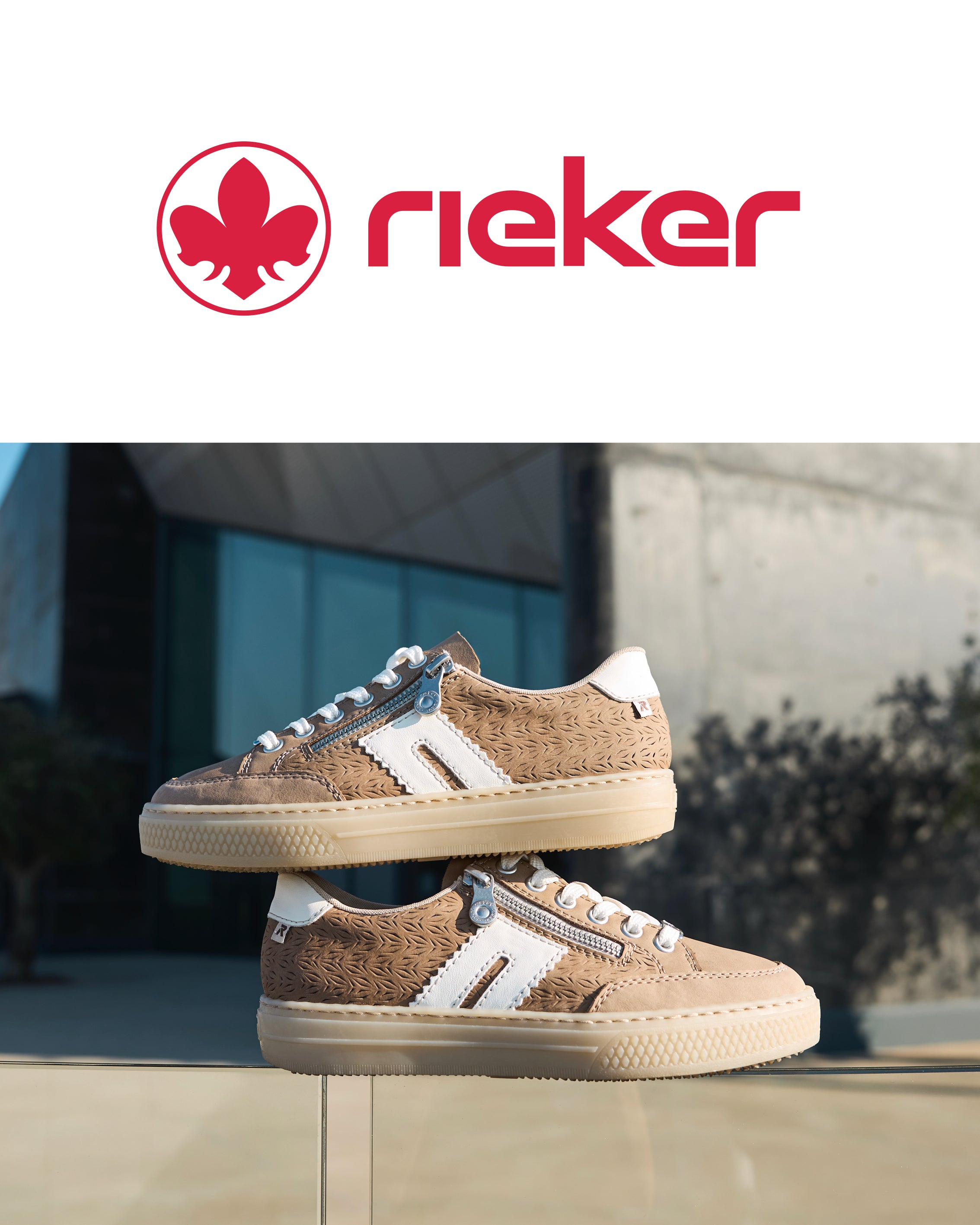 Brown sneakers with white accents on a reflective surface, Rieker logo above.